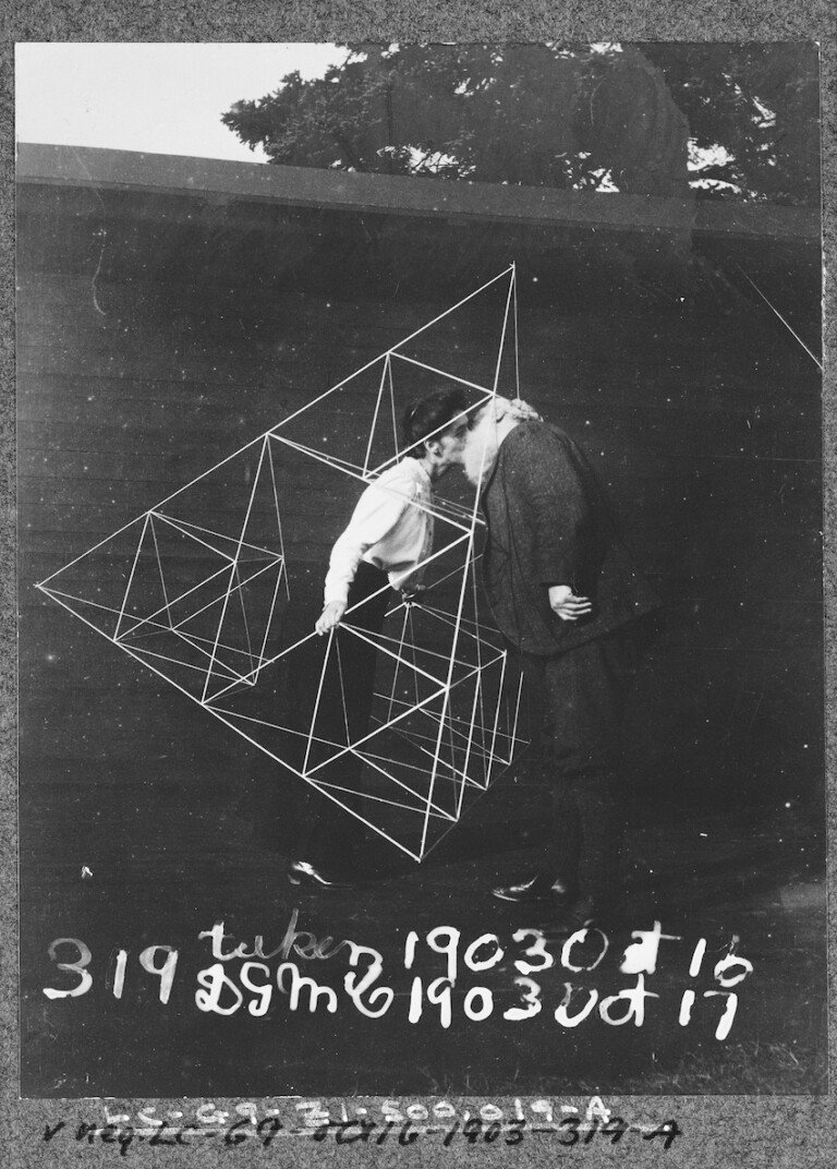 Alexander Graham Bell kissing his wife Mabel Hubbard Gardiner Bell, who is standing in a tetrahedral kite, Baddeck, Nova Scotia Credit Prints and Photographs Division Washington, Library of Congress, LC-DIG-ds-06863