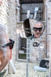 Carlos Garaicoa riflesso in Soñamos en la superficie rayada de un cristal, installation view at Rocca Maggiore, Assisi, 2024. Photo Ela Bialkowska - OKNO studio photography