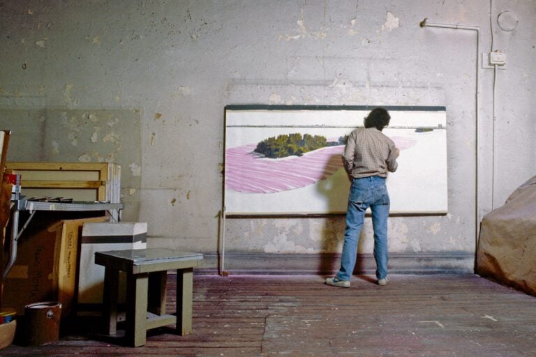 Christo in his studio working on a preparatory drawing for 'Surrounded Islands,' New York, 1983. Photo Wolfgang Volz