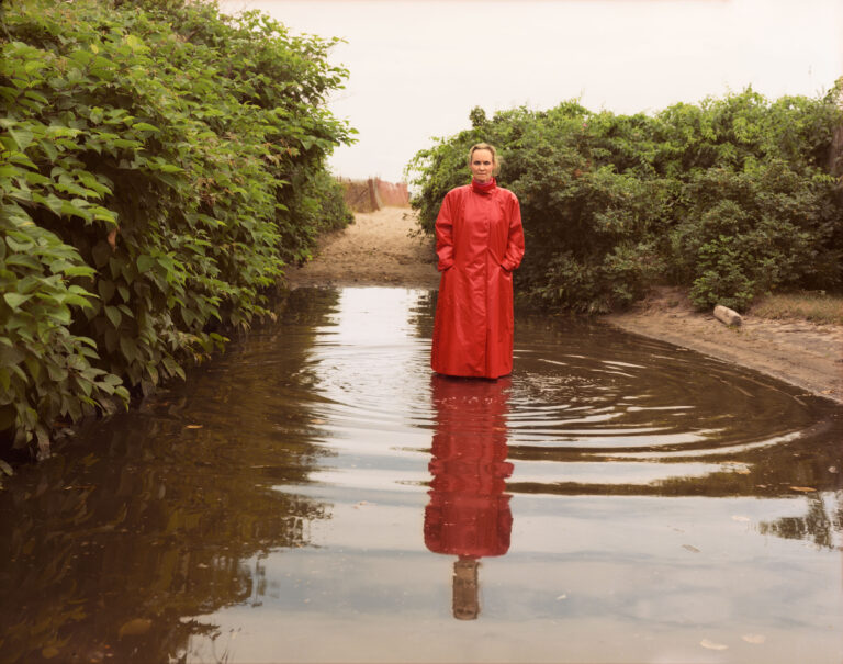 Tina Barney, Self-Portrait in Red Raincoat, 1990